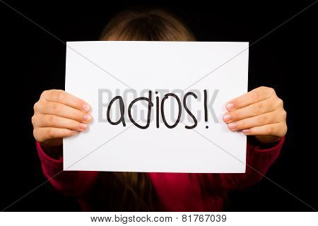 Child Holding Sign With Spanish Word Adios - Goodbye