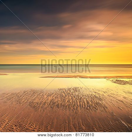 Ocean Sandy Beach Line And Warm Sunset
