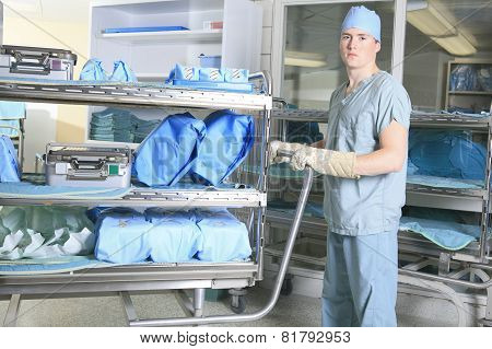 Medical staff sterilizing hands and arms before surgery