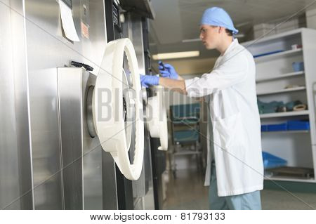 Medical staff sterilizing hands and arms before surgery