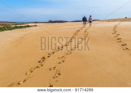 Tourists walking on beach in Oualidia, Atlantic coast of Morocco
