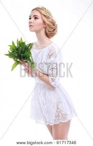 Beautiful sexual blonde  in white clothes with the basket of flowers isolated on a white background