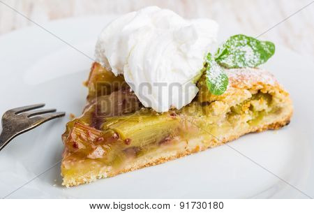 Piece Of Sweet Cake With Rhubarb And Whipped Cream