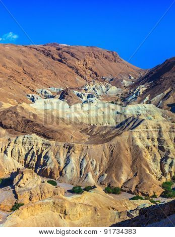 Picturesque multi-colored taluses dry sandstone. Ancient mountains in the valley of the Dead Sea