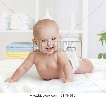 smiling baby in diaper or nappy