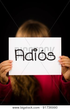 Child Holding Sign With Spanish Word Adios - Goodbye