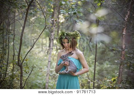 Beautiful Model With A Gray Rabbit In Her Arms