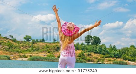 Pretty Young Woman With Arms Raised