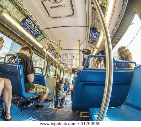 People In The Downtown Metro Bus In Miami, Usa