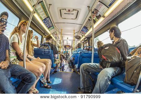 People In The Downtown Metro Bus In Miami, Usa