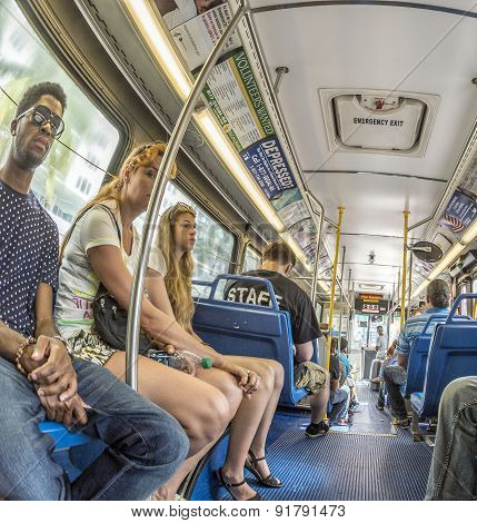 People In The Downtown Metro Bus In Miami, Usa