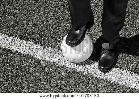 Manager with Soccer Ball on the Touchline