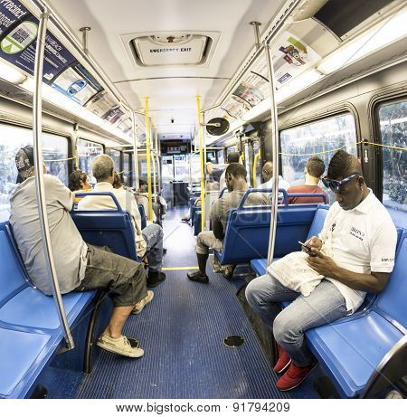 People In The Downtown Metro Bus In The Evening