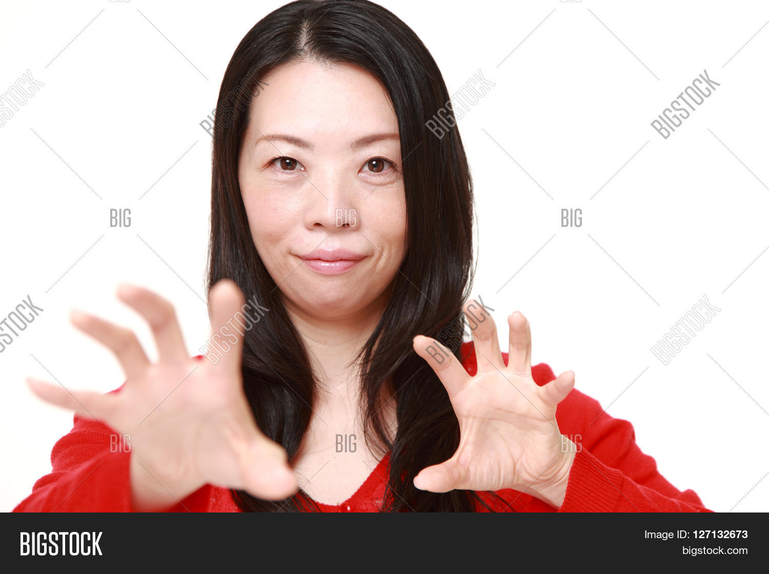 young Japanese woman with supernatural power on white background.