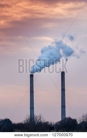 Industrial cityscape with coal power plant and smoke stacks