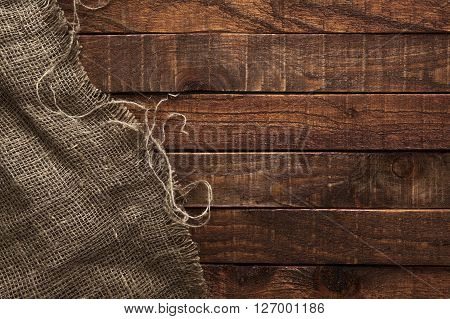 Burlap texture on wooden table background. Wooden table with sacking
