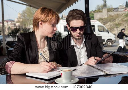 young business man and the woman discussing