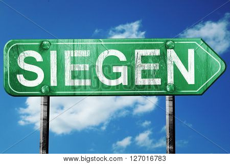 Siegen road sign, on a blue sky background