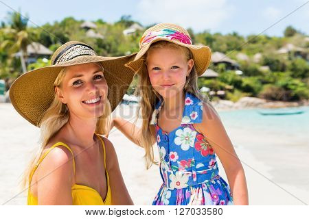 Cute Girl And Beautiful Mother On The Beach