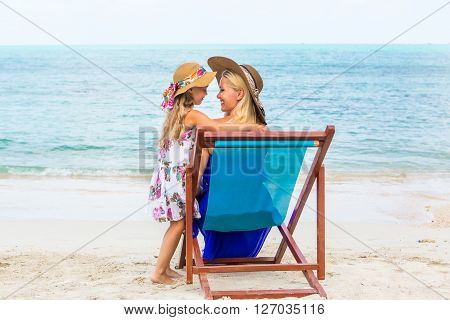 Cute Girl And Beautiful Mother On The Beach