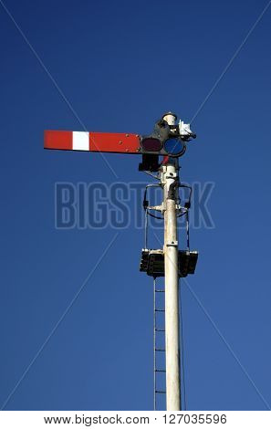 Railway transport track signal in stop position, Norfolk UK.