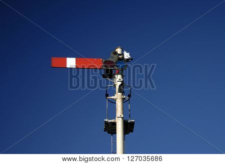 Railway transport track signal in stop position, Norfolk UK.