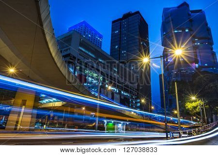 light trails through the footbridge,hongkong china.
