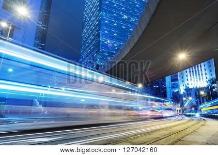 light trails through the footbridge,hongkong china.