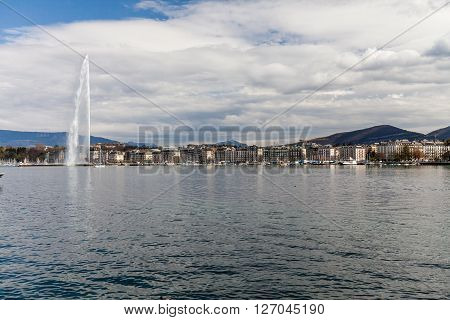 GENEVA, SWITZERLAND - APRIL 11, 2015: Exterior views of the buildings and fountain at the Geneva Lake on April 11 2015. Its the second most populous city in Switzerland (after Zurich).