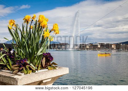 GENEVA, SWITZERLAND - APRIL 11, 2015: Exterior views of the buildings and fountain at the Geneva Lake on April 11 2015. Its the second most populous city in Switzerland (after Zurich).