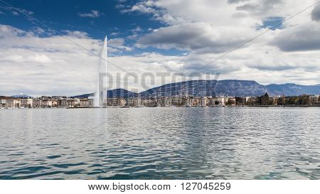 GENEVA, SWITZERLAND - APRIL 11, 2015: Exterior views of the buildings and fountain at the Geneva Lake on April 11 2015. Its the second most populous city in Switzerland (after Zurich).