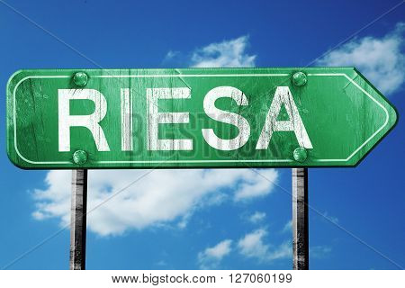 Riesa road sign, on a blue sky background