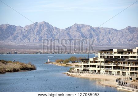 The harbor entrance to Lake Havasu City with houses and apartment buildings on Lake Havasu.