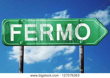 Fermo road sign, on a blue sky background