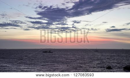 Bather's beach at twilight with a colourful sky and clouds in Fremantle, Western Australia.