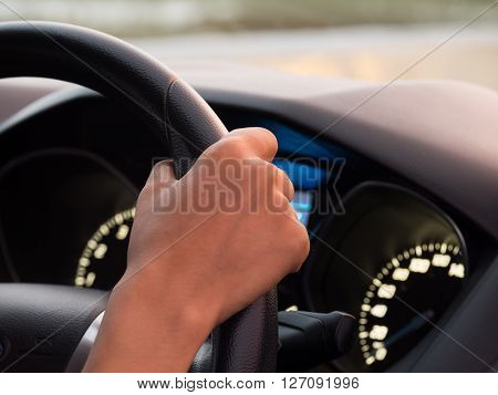 Giel one hand driving car showing meters