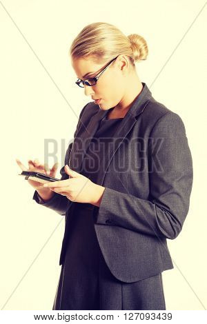 Businesswoman sending a message