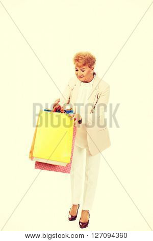 Happy business woman holging shopping bags