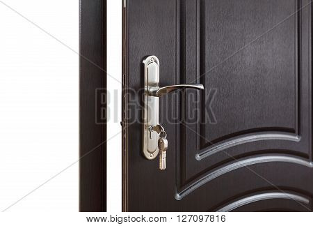 Closed door handle. Door lock with keys. Dark brown wooden door closeup. Modern interior design, door handle. New house concept. Real estate.