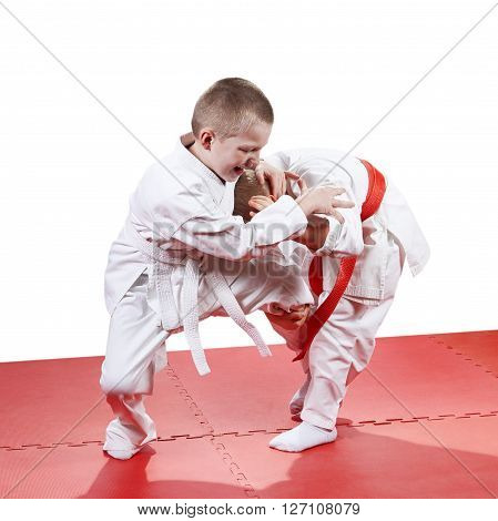 The five-year children  are training judo throws