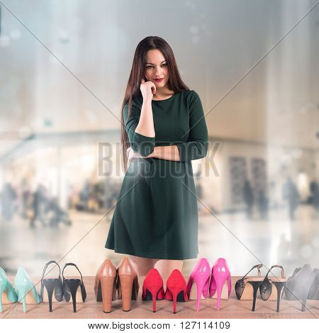 Woman undecided in front of shoes showcase
