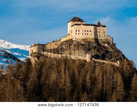 Tarasp Castle - fortified mountain castle in Swiss Alps, Engadin, Switzerland.