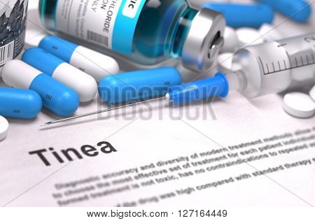 Diagnosis - Tinea. Medical Concept with Blue Pills, Injections and Syringe. Selective Focus. Blurred Background. 3D Render.
