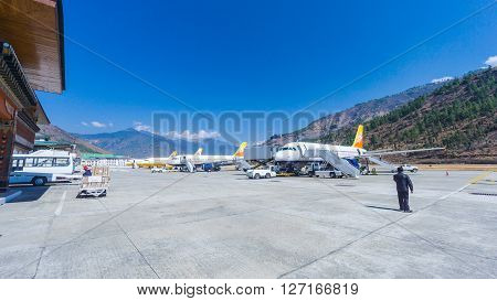 PARO BHUTAN - March 2 2016: People arriving at Paro airport Bhutan with druk air the 