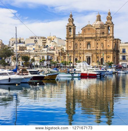 Landmarks of Malta - Msida cathedral and marina with the sail boats