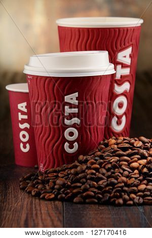 Composition With Cups Of Costa Coffee Coffee And Beans
