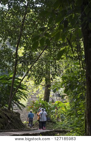 Tourists At Palenque Archaeological Site In Mexico