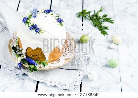 Traditional easter cake decorated with icing and flowers