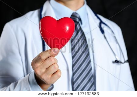 Male Medicine Doctor Wearing Hold In Hands Red Toy Heart