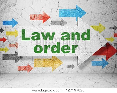 Law concept:  arrow with Law And Order on grunge textured concrete wall background, 3D rendering